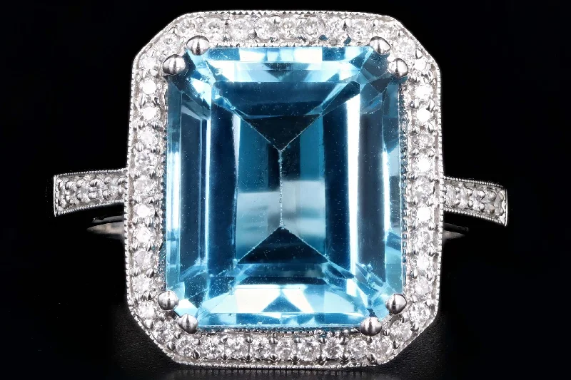 18K White Gold 7.20 Carat Emerald Cut Blue Topaz & Diamond Halo Ring